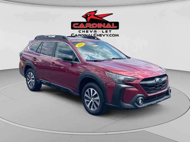 2025 Subaru Outback Premium in Crimson Red Pearl — front three-quarter view